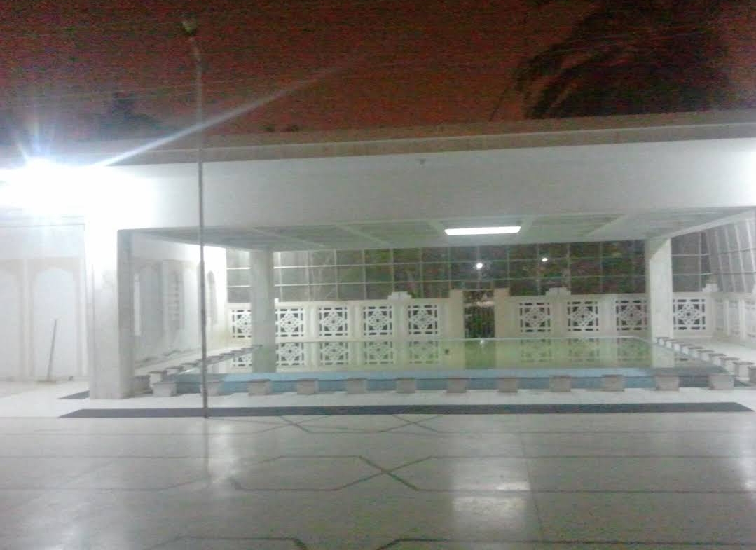 The wuzu khana area at Bait ul Mukarram at night showing the pool and ablution area, since dismantled